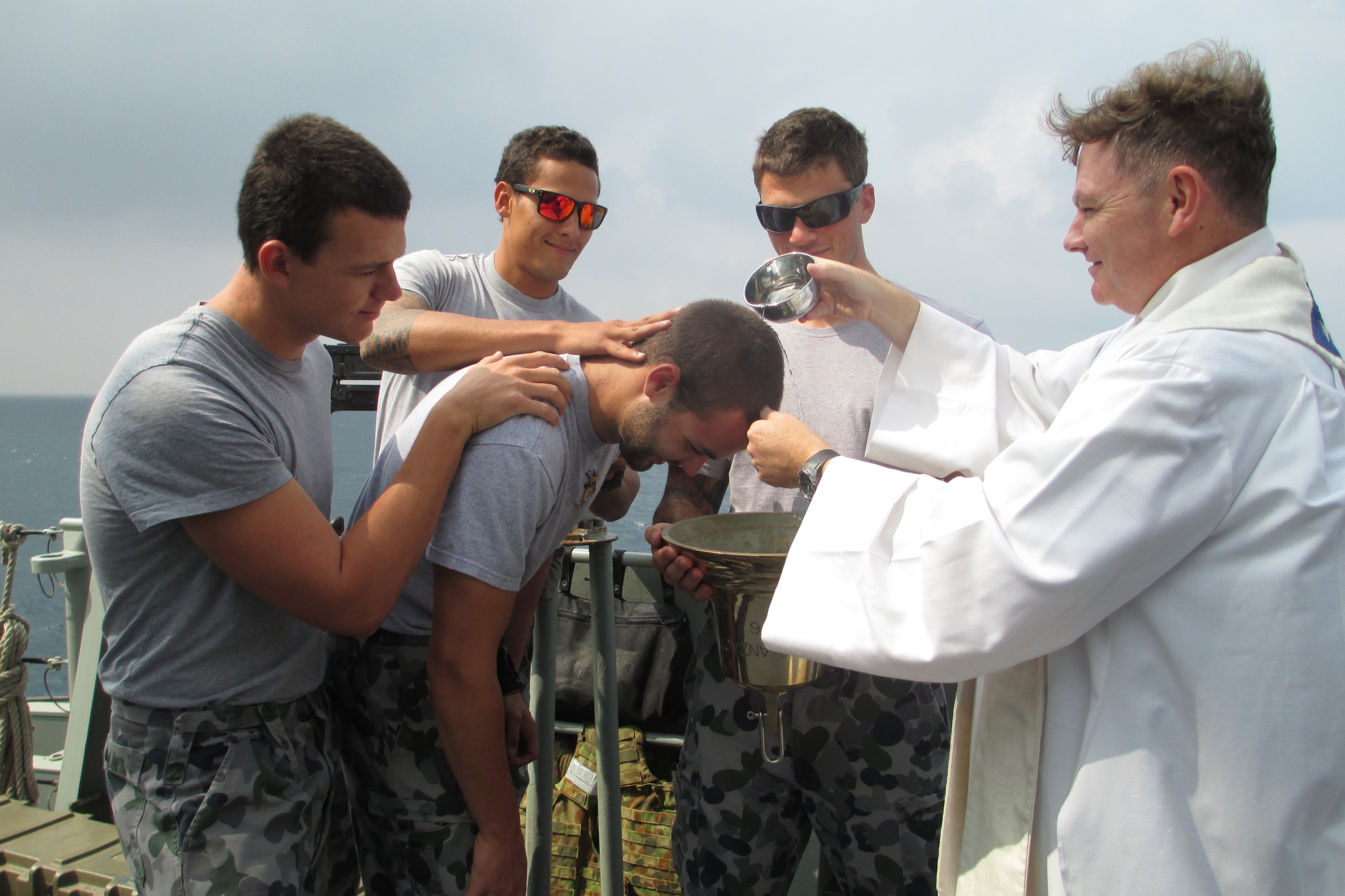 Fr Paul Stuart Baptising sailors at sea